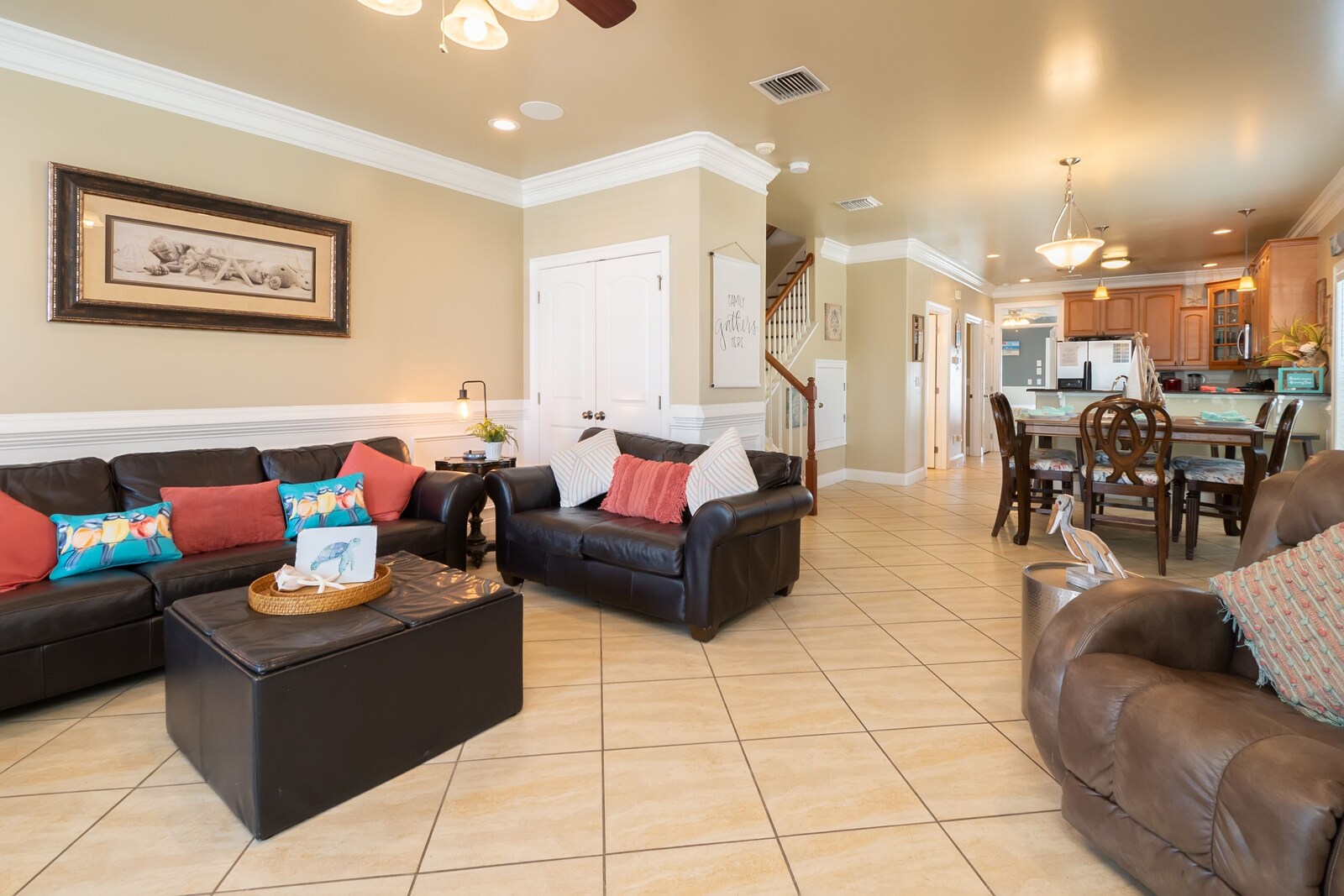 couch, interior, refrigerator, living area, indoor, interior staircase, microwave, handrail, dining table, kitchen visible, daytime at Albacore Adventure PCB