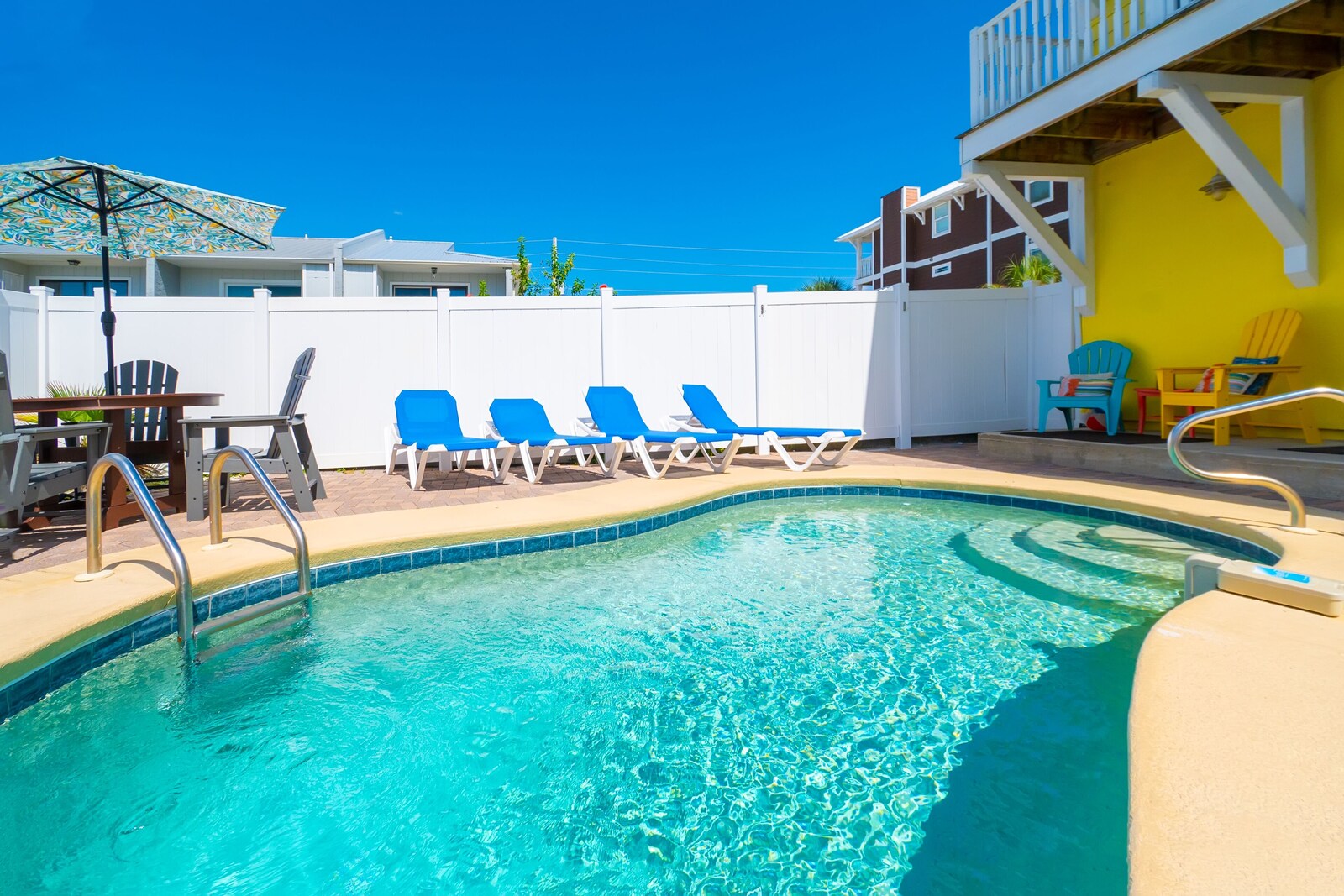 private outdoor saltwater pool, fence, handrail, and sun loungers at Albacore Adventure PCB