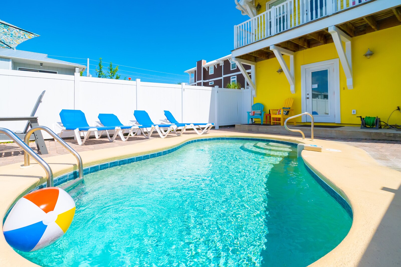 private outdoor pool area, fenced patio, handrail, and sun loungers at Albacore Adventure PCB