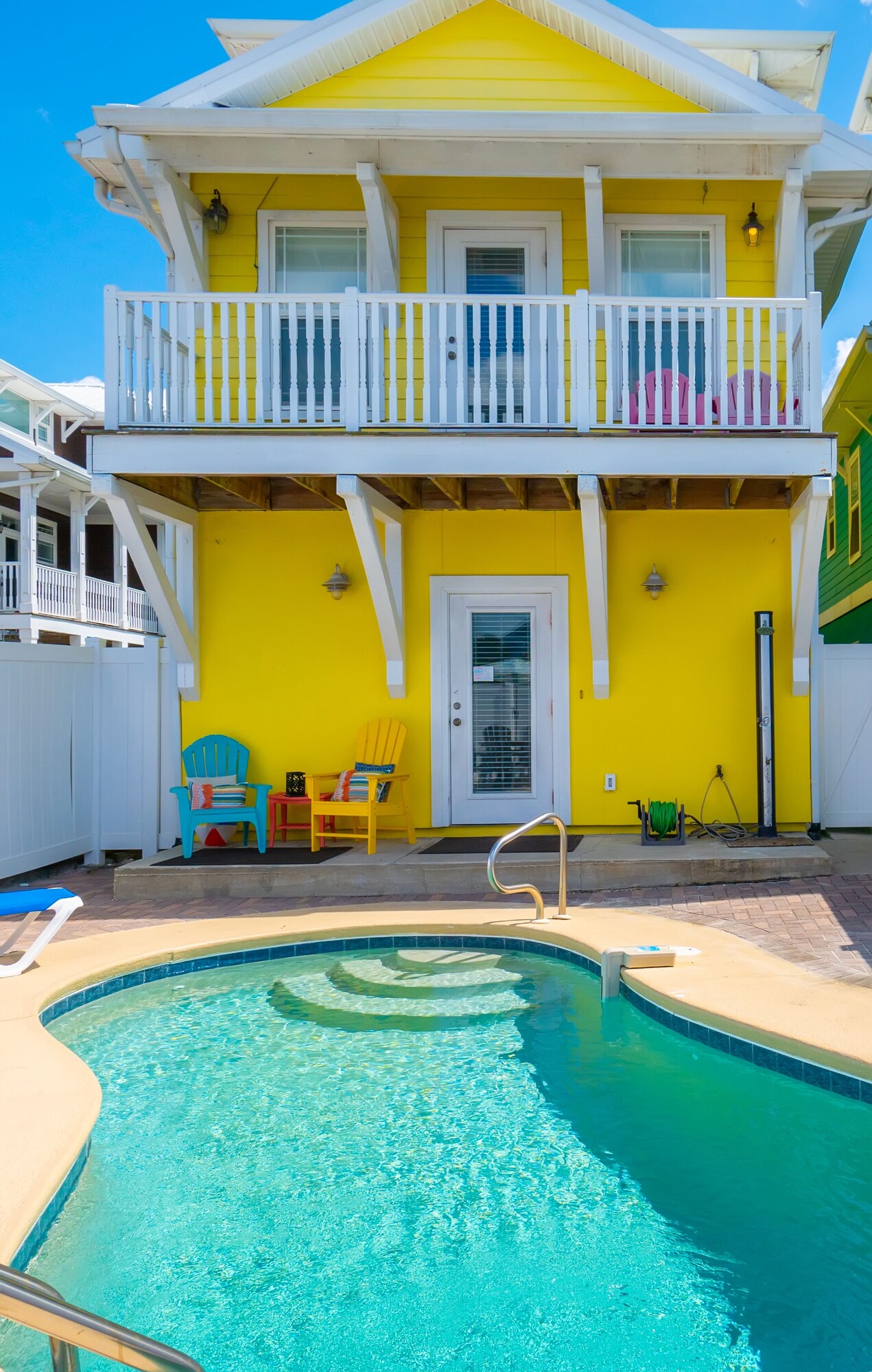 Private pool behind the yellow Albacore Adventure beach house